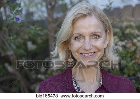 Stock Photo - Close up of smiling Caucasian woman outdoors. Fotosearch