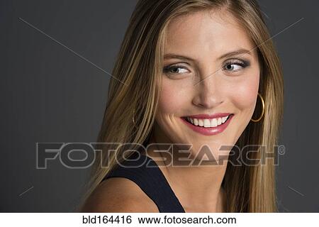 Stock Photograph - Close up of smiling Caucasian woman. Fotosearch
