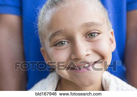 Stock Photograph - Close up of smiling girl with father. Fotosearch