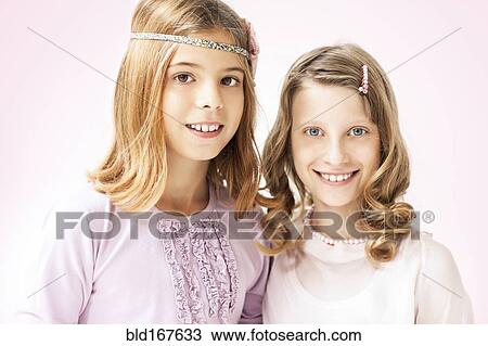 Close up of smiling girls standing View Large Photo Image Stock Image - Close up of smiling girls standing. Fotosearch
