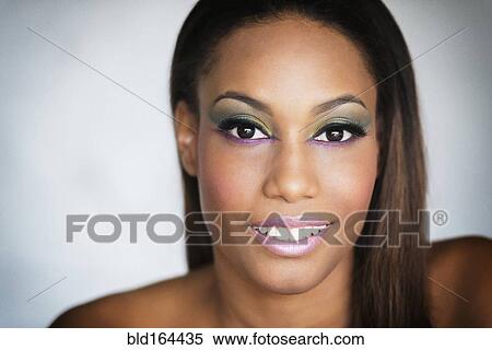 Stock Photography - Close up of smiling mixed race woman. Fotosearch