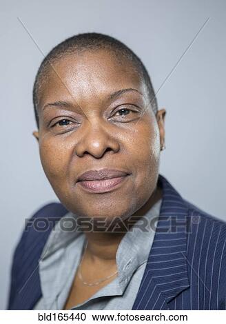Stock Image - Close up of smiling older woman. Fotosearch