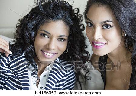 Stock Photo - Close up of smiling women. Fotosearch