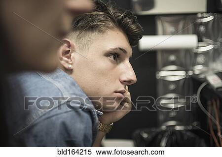 Stock Photography - Close up profile of leaning Caucasian man. Fotosearch