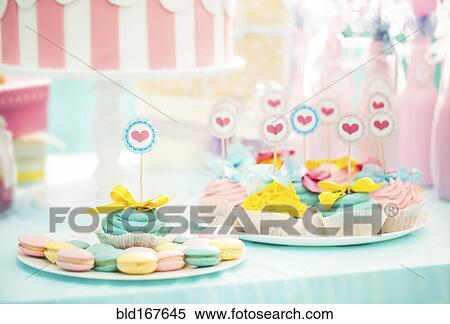 Stock Photography - Cookies and cupcakes at birthday party. Fotosearch