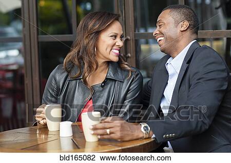 Couple drinking coffee at cafe View Large Photo Image Stock Image - Couple drinking coffee at cafe. Fotosearch