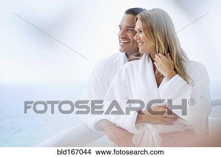 Couple hugging on balcony View Large Photo Image Picture - Couple hugging on balcony. Fotosearch
