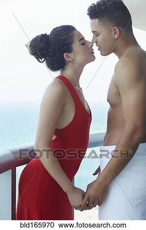 Couple kissing on balcony View Large Photo Image Stock Image - Couple kissing on balcony. Fotosearch