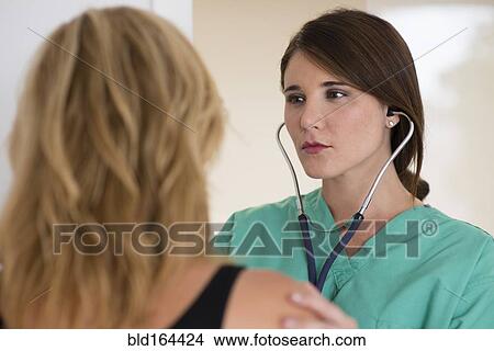 Doctor talking to patient in hospital View Large Photo Image Picture - Doctor talking to patient in hospital. Fotosearch