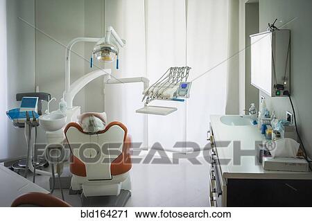 Stock Image - Empty chair in office of dentist. Fotosearch