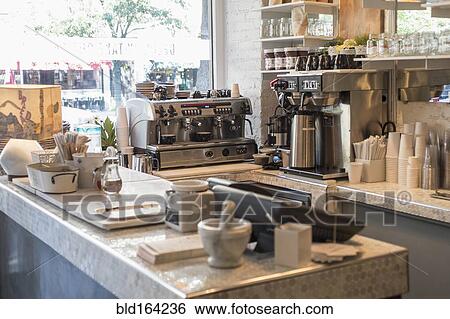 Stock Photograph - Empty counter and coffee makers in cafe. Fotosearch