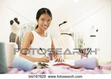 Fashion designer drawing in studio View Large Photo Image Stock Photo - Fashion designer drawing in studio. Fotosearch