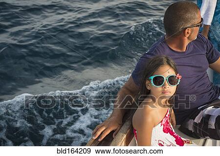 Father and daughter sitting on boat View Large Photo Image Stock Photo - Father and daughter sitting on boat. Fotosearch