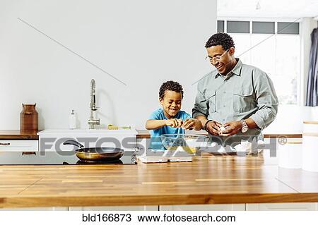 Father and son cooking in kitchen View Large Photo Image Stock Image - Father and son cooking in kitchen. Fotosearch