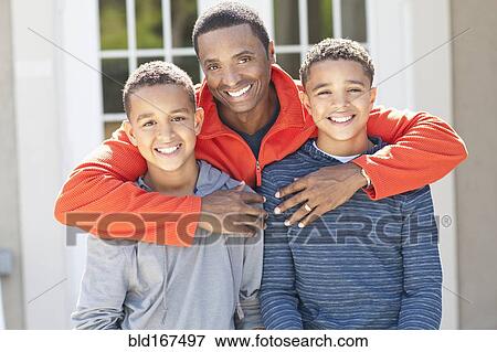Father hugging sons outdoors View Large Photo Image Stock Photo - Father hugging sons outdoors. Fotosearch