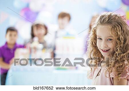 Girl smiling at birthday party View Large Photo Image Stock Image - Girl smiling at birthday party. Fotosearch