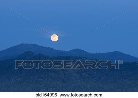 Glowing moon rising over foothills, Oakhurst Foothills, California, United States View Large Photo Image Stock Photograph - Glowing moon rising over foothills, Oakhurst Foothills, California, United States. Fotosearch