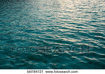 Stock Image - High angle view of rippling ocean surface. Fotosearch