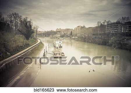 High angle view of still urban canal in city View Large Photo Image Stock Image - High angle view of still urban canal in city. Fotosearch