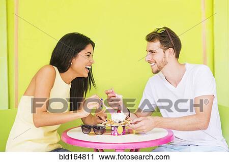 Hispanic couple sharing ice cream sundae View Large Photo Image Stock Image - Hispanic couple sharing ice cream sundae. Fotosearch