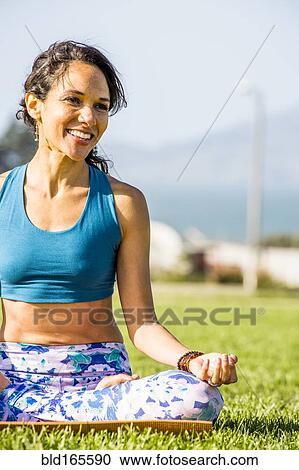 Hispanic woman practicing yoga in urban park View Large Photo Image Stock Image - Hispanic woman practicing yoga in urban park. Fotosearch