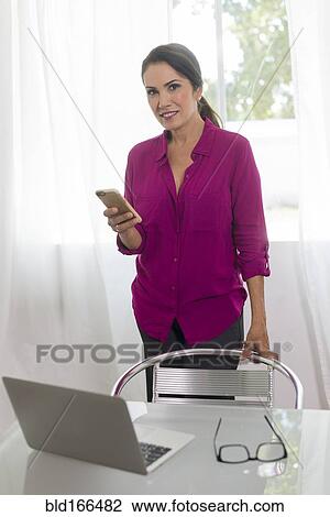 Hispanic woman shopping online with laptop View Large Photo Image Stock Image - Hispanic woman shopping online with laptop. Fotosearch