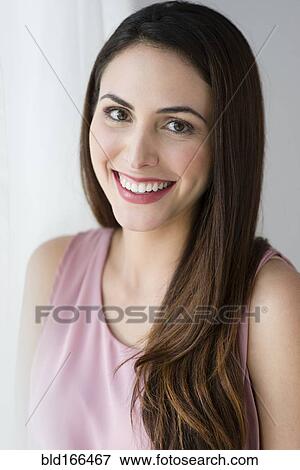 Stock Photo - Hispanic woman smiling. Fotosearch