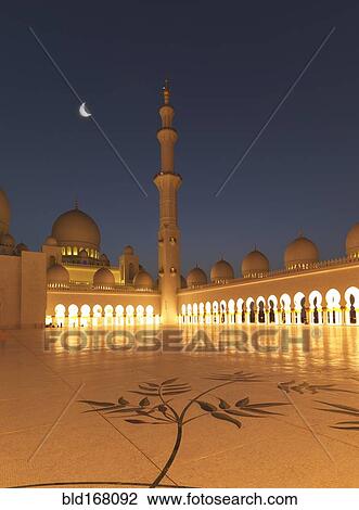 Stock Image - Illuminated colonnade, domes and tower at night. Fotosearch