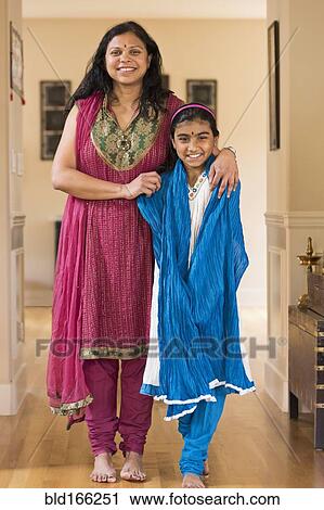 Indian mother and daughter wearing traditional dresses View Large Photo Image Stock Image - Indian mother and daughter wearing traditional dresses. Fotosearch
