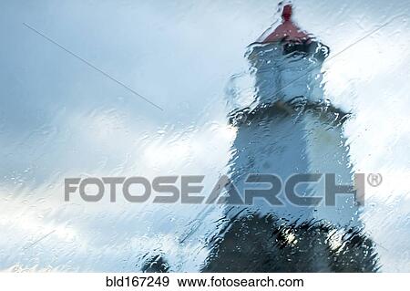 Laukvika Lighthouse viewed through rainy window, Laukvika, Lofoten Islands, Norway View Large Photo Image Stock Photo - Laukvika Lighthouse viewed through rainy window, Laukvika, Lofoten Islands, Norway. Fotosearch