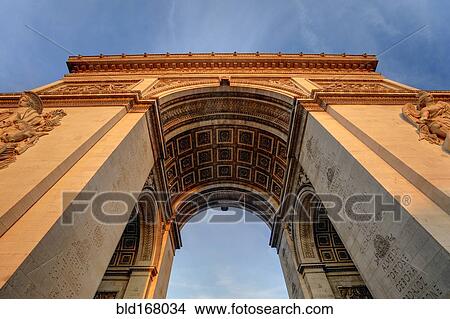 Low angle view of Arc de Triomphe under blue sky, Paris, Ile-de-France, France View Large Photo Image Picture - Low angle view of Arc de Triomphe under blue sky, Paris, Ile-de-France, France. Fotosearch