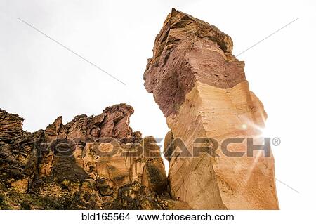 Picture - Low angle view of rock formation and cliff, Smith Rock State Park, Oregon, United States. Fotosearch