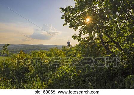 Mari man walking in rural landscape View Large Photo Image Stock Photography - Mari man walking in rural landscape. Fotosearch