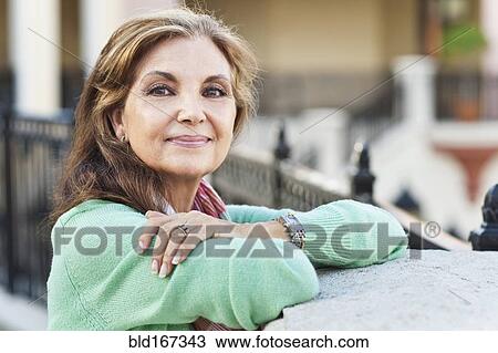 Middle Eastern woman leaning on gate View Large Photo Image Stock Image - Middle Eastern woman leaning on gate. Fotosearch