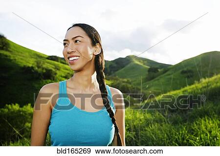 Mixed race athlete standing on rural hillside View Large Photo Image Stock Photo - Mixed race athlete standing on rural hillside. Fotosearch