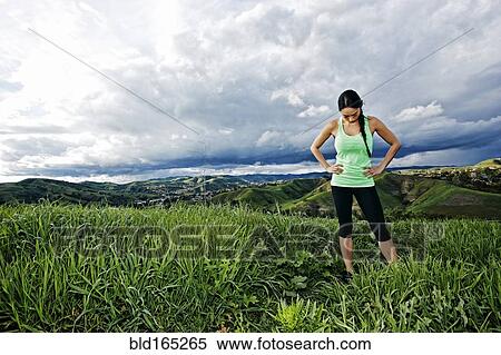 Mixed race athlete standing on rural hilltop View Large Photo Image Stock Photography - Mixed race athlete standing on rural hilltop. Fotosearch