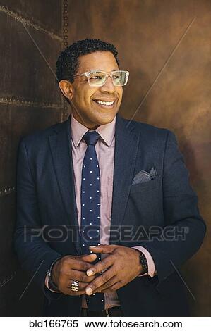 Stock Photography - Mixed race businessman smiling. Fotosearch