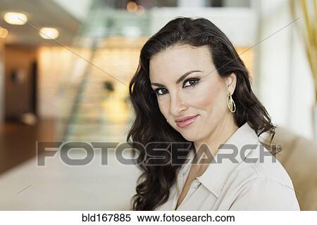 Mixed race businesswoman sitting in hotel lobby View Large Photo Image Stock Photography - Mixed race businesswoman sitting in hotel lobby. Fotosearch