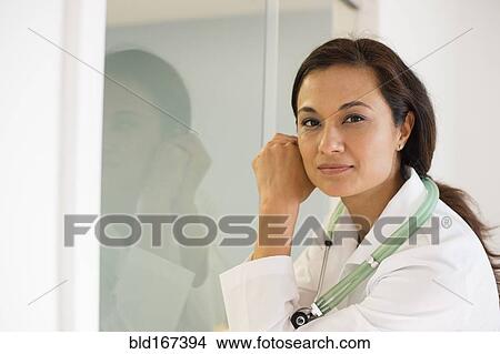 Picture - Mixed race doctor wearing stethoscope. Fotosearch