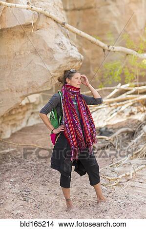 Mixed race hiker exploring desert rock formations barefoot View Large Photo Image Picture - Mixed race hiker exploring desert rock formations barefoot. Fotosearch