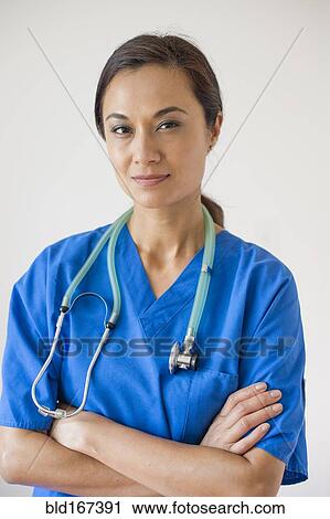 Mixed race nurse wearing stethoscope View Large Photo Image Stock Image - Mixed race nurse wearing stethoscope. Fotosearch