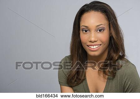 Picture - Mixed race woman smiling. Fotosearch