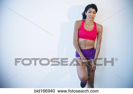 Stock Image - Mixed race woman wearing sportswear. Fotosearch