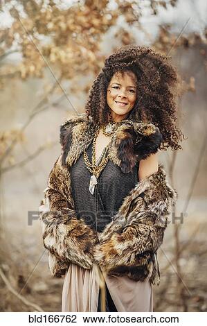 Mixed race woman wearing stylish clothes View Large Photo Image Stock Image - Mixed race woman wearing stylish clothes. Fotosearch