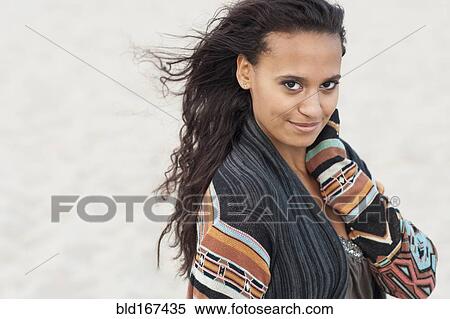 Mixed race woman wearing stylish sweater View Large Photo Image Stock Photography - Mixed race woman wearing stylish sweater. Fotosearch