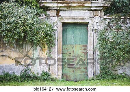 Mossy dilapidated stone wall in garden View Large Photo Image Stock Photo - Mossy dilapidated stone wall in garden. Fotosearch