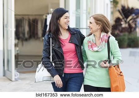 Mother and daughter walking outdoors View Large Photo Image Stock Image - Mother and daughter walking outdoors. Fotosearch