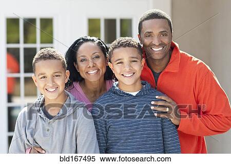 Mother, father and sons smiling outdoors View Large Photo Image Stock Photography - Mother, father and sons smiling outdoors. Fotosearch