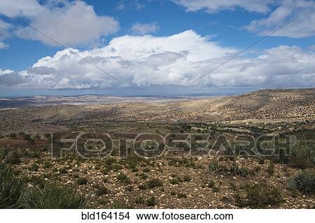 Picture - Mountains and scrubland fields in remote landscape. Fotosearch