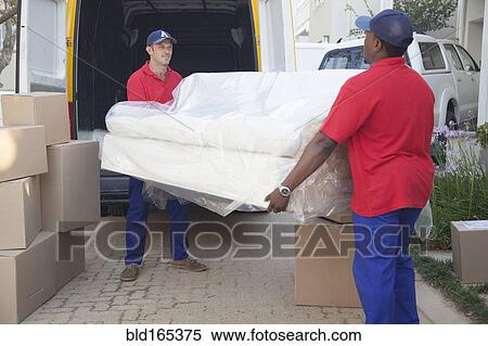 Stock Photography - Movers carrying sofa to new home. Fotosearch